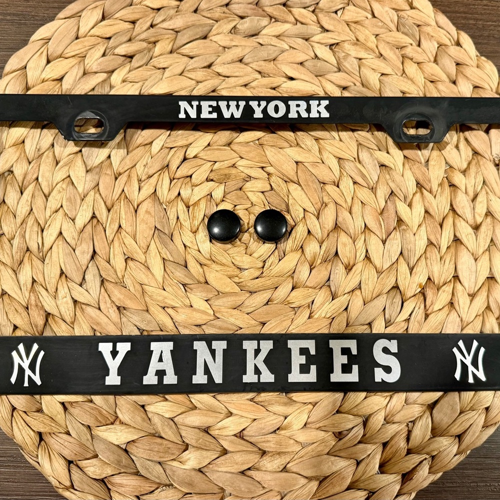New York Yankees Black License Plate Frame with screw caps.